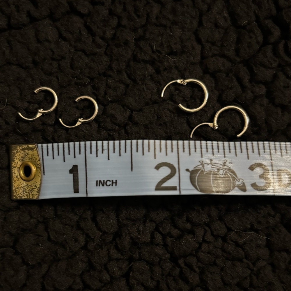 Two pairs of tiny click hoop earrings